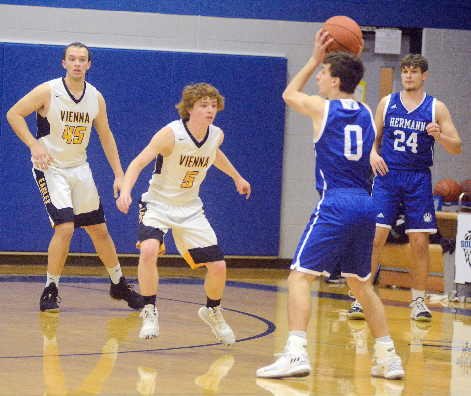Lucas Magner (second from left) guards Hermann Bearcat ball handler Connor Coffey with Snodgrass behind him also on defense.